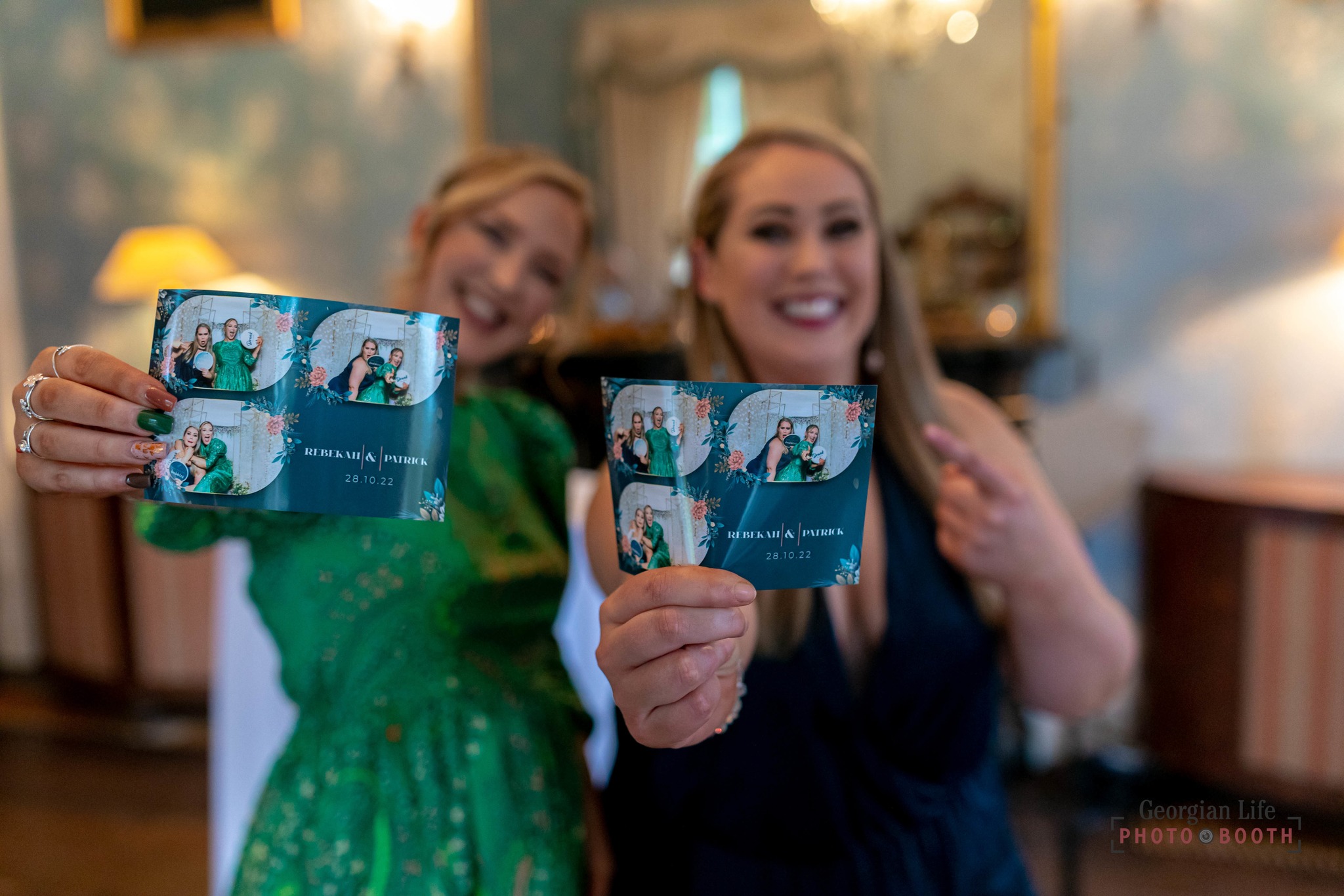 Ladies showing prints of photos they had taken at a wedding or party Weddings
